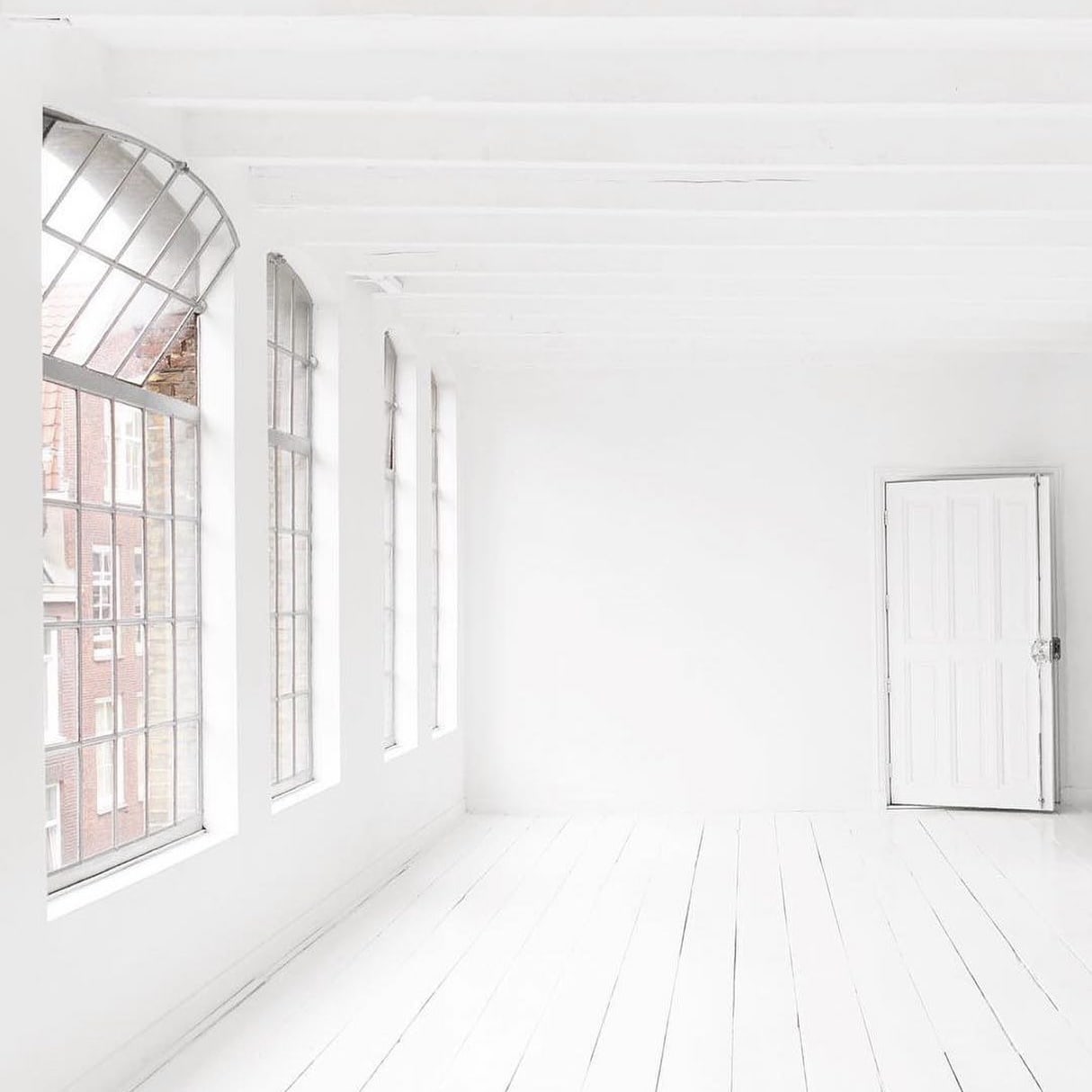 white space with wooden floor and windows