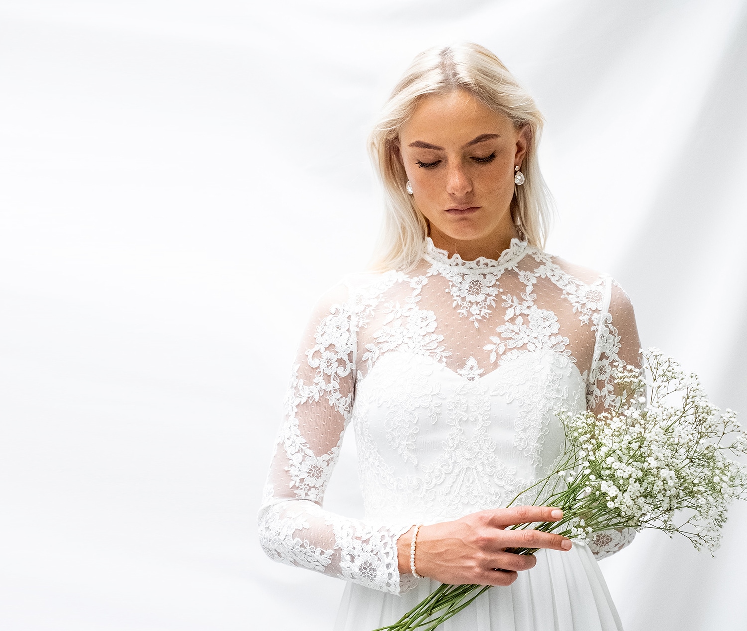 Bride with high neckline lace wedding gown