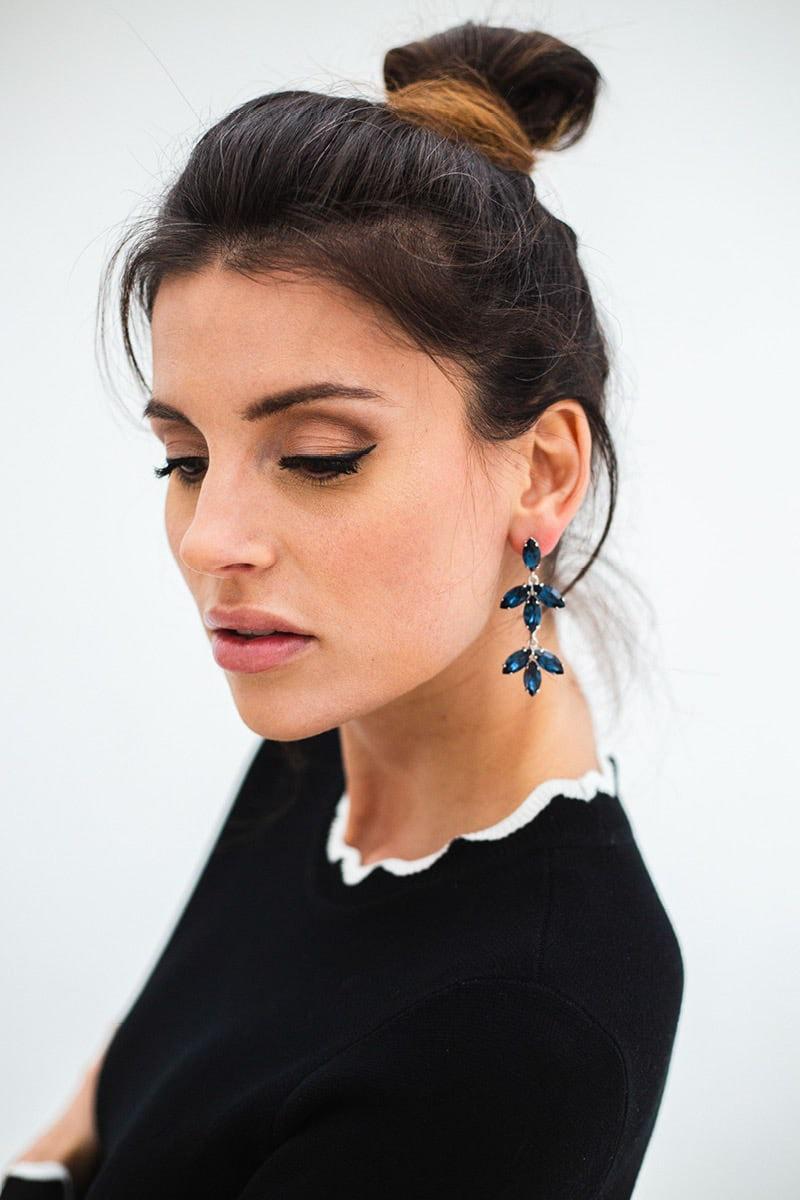 Woman wearing blue earrings